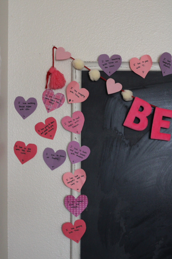 paper hearts on and around a chalkboard
